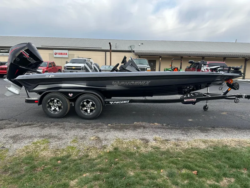 Slide: The Image of 2025 Phoenix 721 ZXL boat on trailer, parked outdoors near dealership. - 5