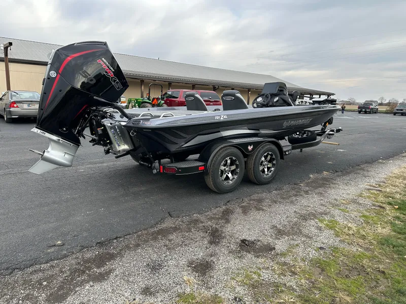 Slide: The Image of 2025 Phoenix 721 ZXL boat on trailer, parked outdoors. - 6