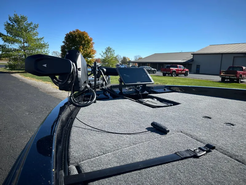 Slide: The Image of 2025 Phoenix 21 XE boat deck with mounted electronics and clear blue sky. - 12