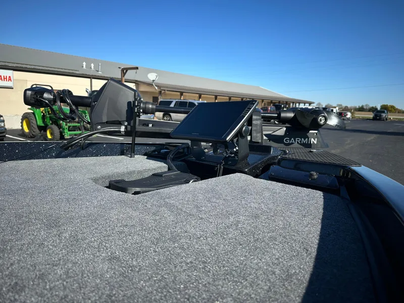 Slide: The Image of 2025 Phoenix 21 XE boat with Garmin navigation system on deck. - 14