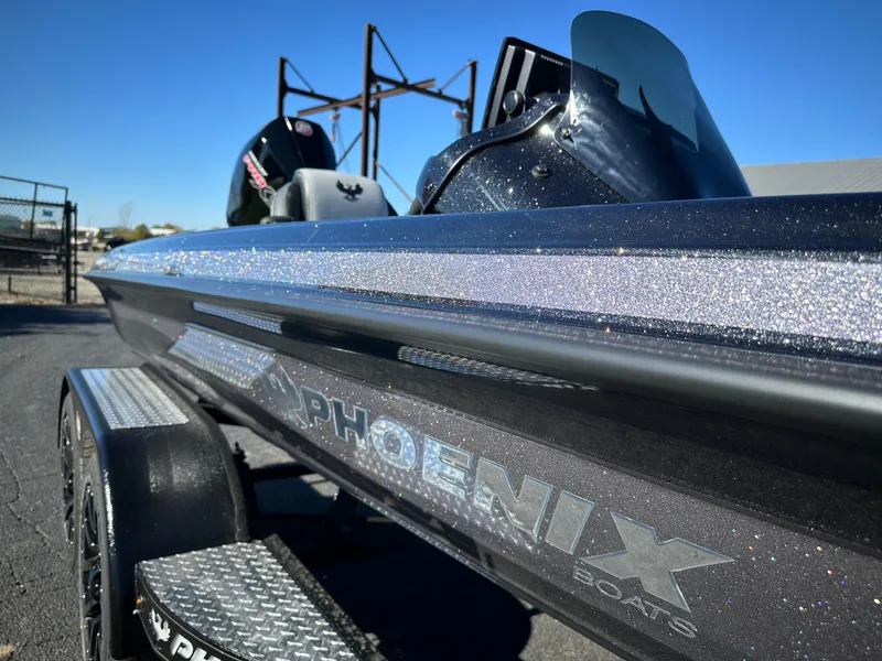 Slide: The Image of 2025 Phoenix 21 XE boat with sleek design and metallic finish. - 15