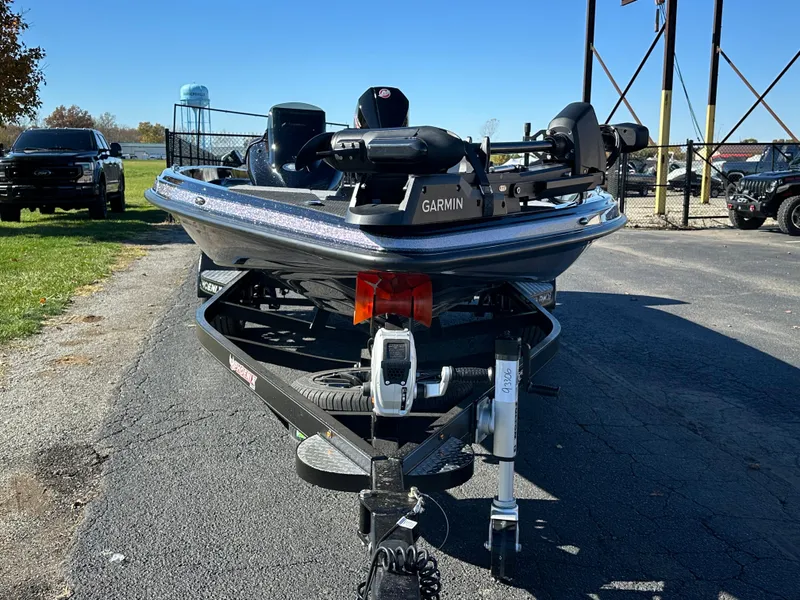 Slide: The Image of 2025 Phoenix 21 XE boat with Garmin equipment on a trailer, parked outdoors. - 3