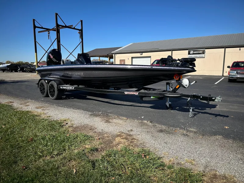 Slide: The Image of 2025 Phoenix 21 XE boat on trailer in parking lot. - 4