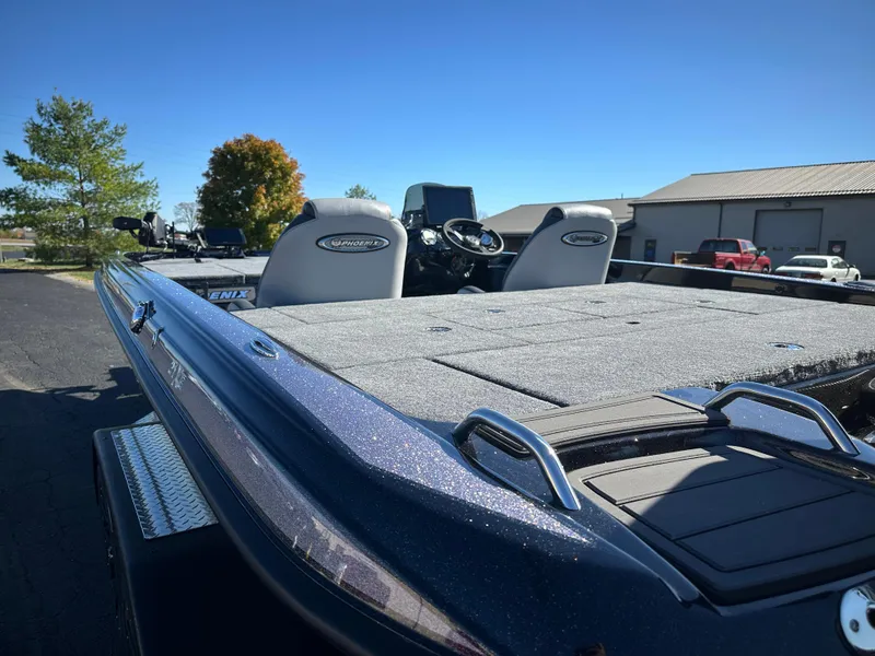 Slide: The Image of 2025 Phoenix 21 XE boat with dual seats, sleek design, and spacious deck. - 8