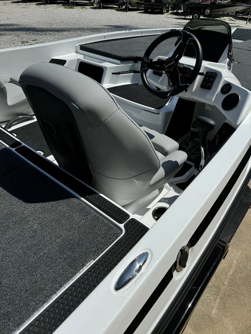 Slide: The Image of 2025 iKon VLX21 boat interior with steering wheel and seating. - 5