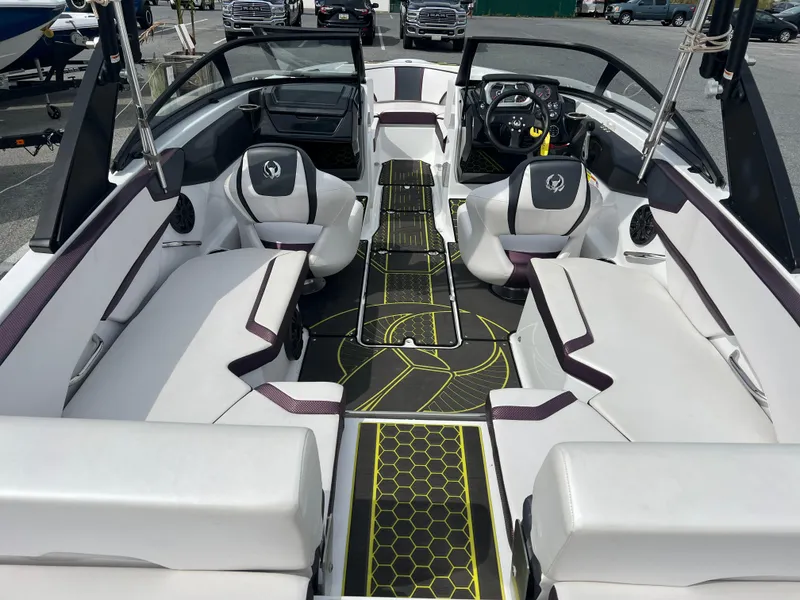 Slide: The Image of 2020 Scarab 215ID boat interior with modern seating and sleek design. - 12