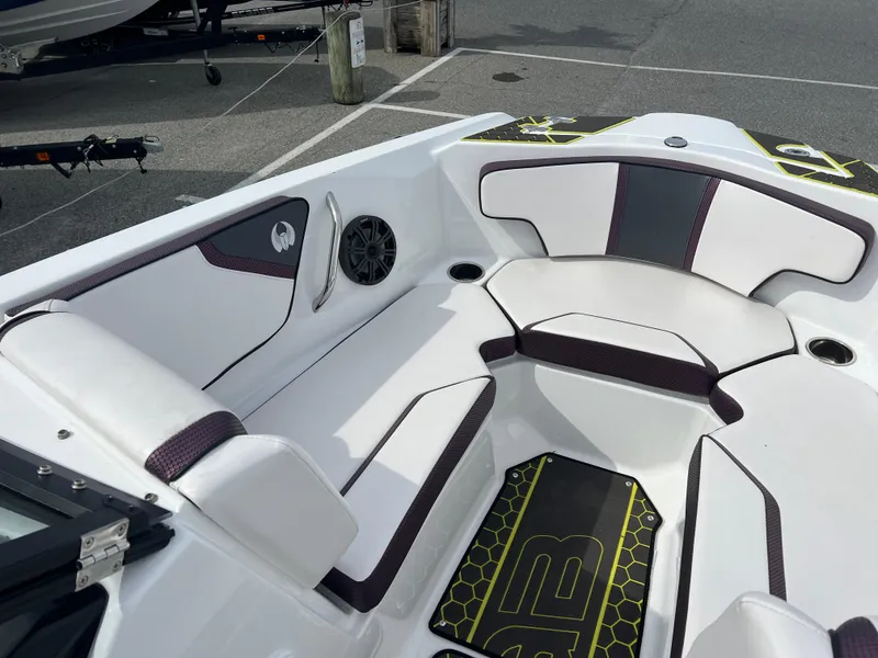 Slide: The Image of 2020 Scarab 215ID boat interior with white and black seating, modern design. - 6