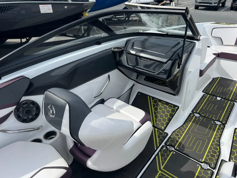 Slide: The Image of 2020 Scarab 215ID boat interior with sleek seating and modern dashboard design. - 8