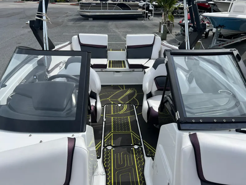 Slide: The Image of 2020 Scarab 215ID boat interior with modern seating and sleek design. - 9