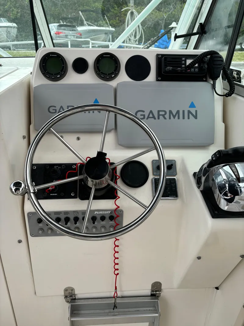 Slide: The Image of Boat dashboard of a 1995 Pursuit 2470 with Garmin navigation equipment. - 15