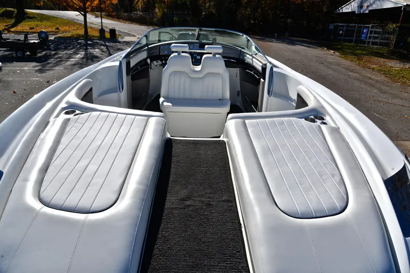 Slide: The Image of 2005 Cobalt 343 boat interior with white seating and sleek design. - 22