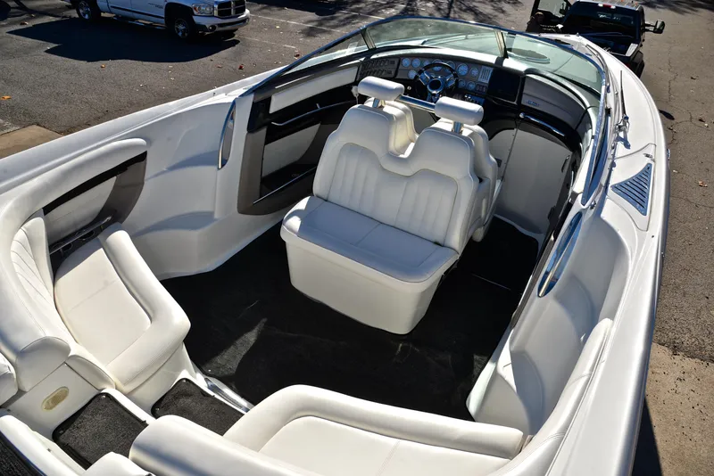 Slide: The Image of 2005 Cobalt 343 boat interior with white leather seats and sleek design. - 23