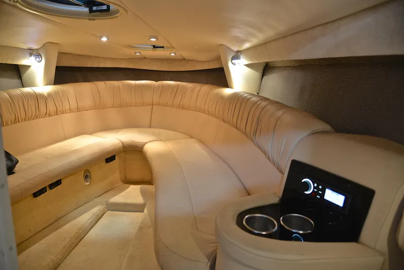 Slide: The Image of Luxurious interior of a 2005 Cobalt 343 boat with plush seating and modern amenities. - 31