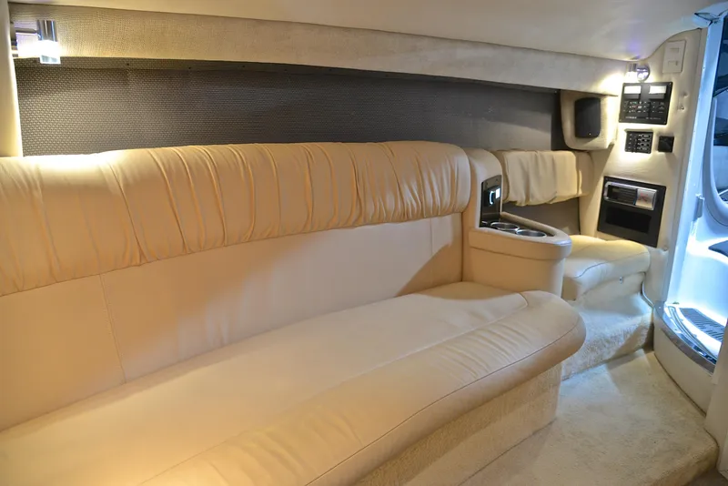 Slide: The Image of Luxurious interior of a 2005 Cobalt 343 boat with beige leather seating. - 33