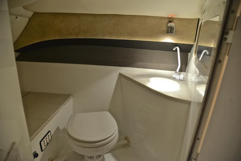 Slide: The Image of Interior of 2005 Cobalt 343 boat bathroom with toilet and sink. - 34