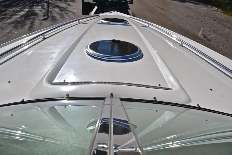 Slide: The Image of 2005 Cobalt 343 boat deck with sleek design and circular hatches. - 35