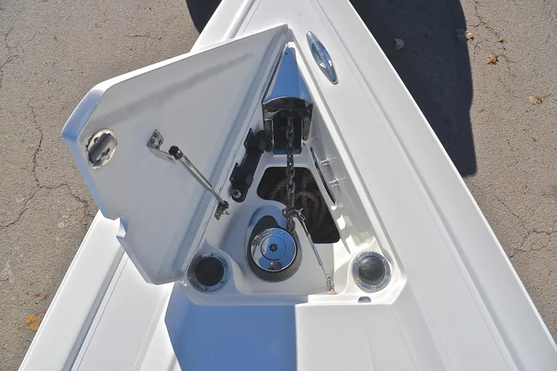 Slide: The Image of Open anchor compartment on 2005 Cobalt 343 boat, showcasing anchor mechanism. - 36