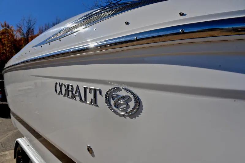 Slide: The Image of Close-up of 2005 Cobalt 343 boat with logo and sleek white exterior. - 42