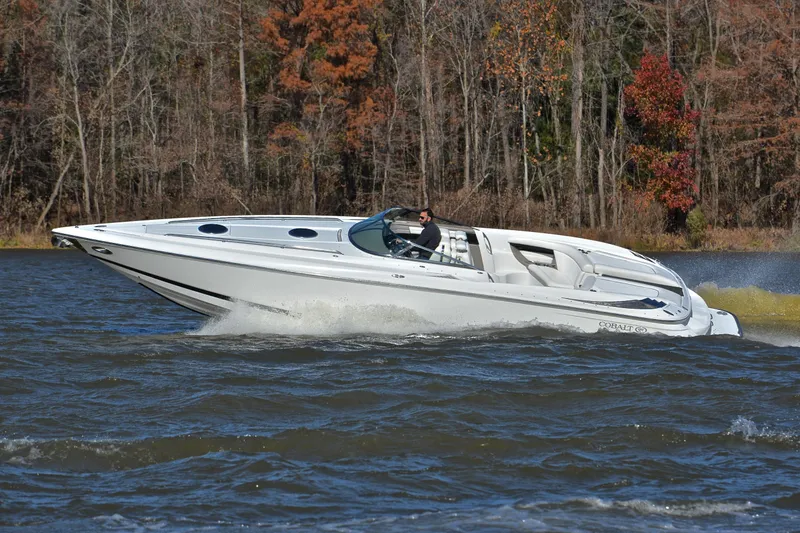 Slide: The Image of 2005 Cobalt 343 speedboat cruising on a lake with autumn trees in the background. - 8