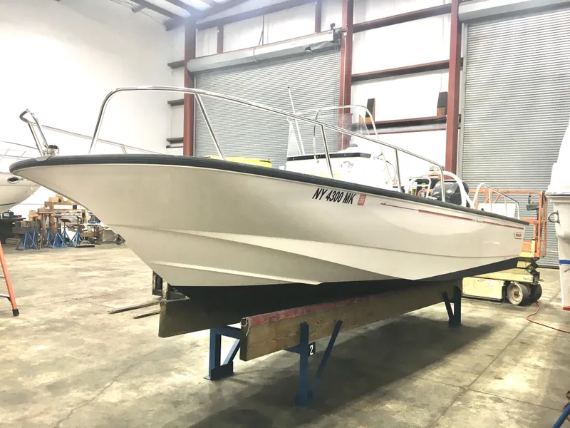 Slide: The Image of 2015 Boston Whaler 210 Montauk boat in indoor storage facility. - 19