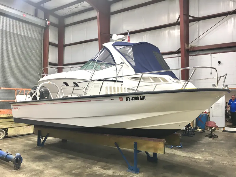 Slide: The Image of 2015 Boston Whaler 210 Montauk boat in indoor storage facility. - 20