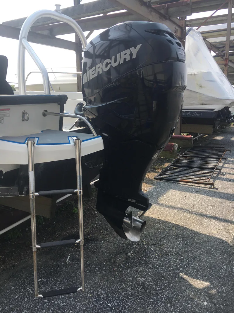 Slide: The Image of 2015 Boston Whaler 210 Montauk with Mercury outboard motor and swim ladder. - 24