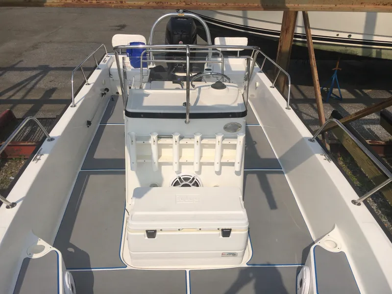 Slide: The Image of 2015 Boston Whaler 210 Montauk boat interior with center console and seating. - 4