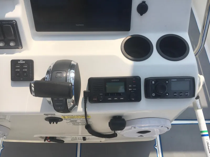 Slide: The Image of Control panel of a 2015 Boston Whaler 210 Montauk boat with navigation equipment. - 9