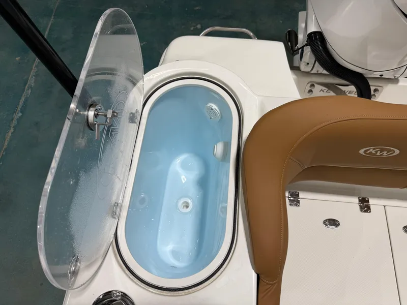 Slide: The Image of 2025 Key West 291FS boat livewell and seating detail. - 14