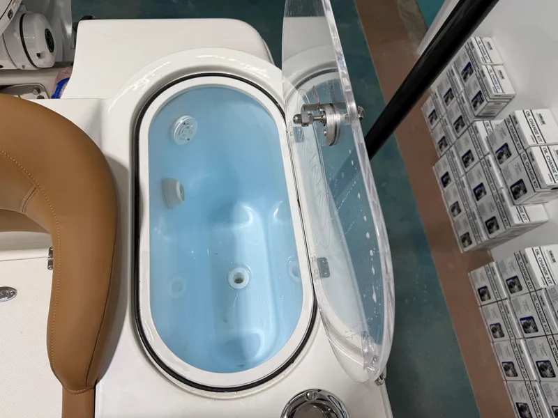 Slide: The Image of 2025 Key West 291FS boat livewell with open lid, showcasing interior design. - 15