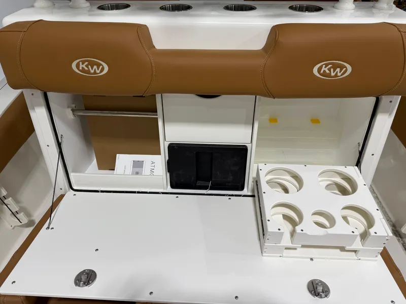 Slide: The Image of 2025 Key West 291FS boat interior with storage and cup holders. - 23