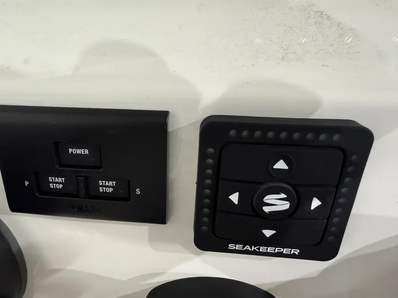 Slide: The Image of Key West 291FS 2025 boat control panel with Seakeeper stabilizer buttons. - 30