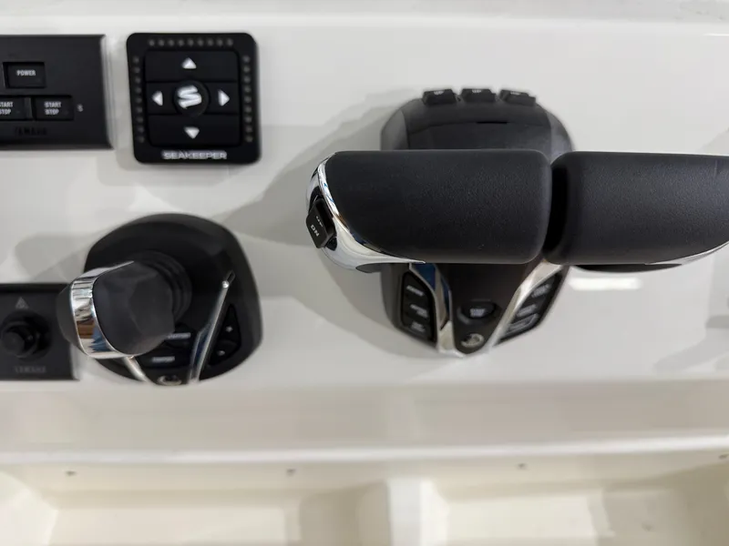 Slide: The Image of Close-up of 2025 Key West 291FS boat controls and dashboard. - 31