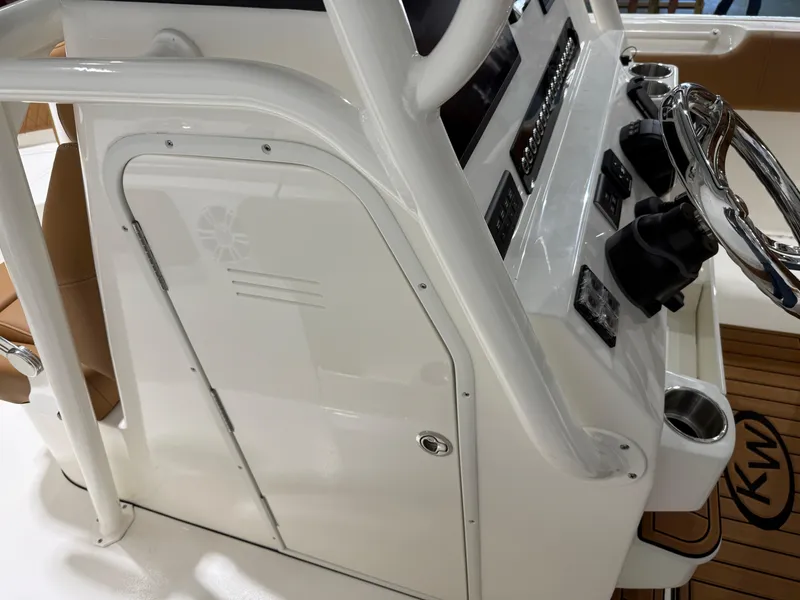 Slide: The Image of 2025 Key West 291FS boat console with steering wheel and controls. - 38