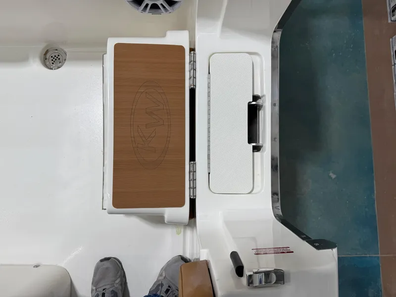 Slide: The Image of 2025 Key West 291FS boat deck with storage compartments and speaker. - 40