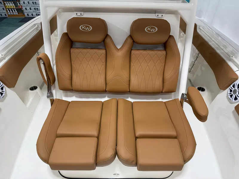 Slide: The Image of 2025 Key West 291FS boat with luxurious tan leather seating and armrests. - 44
