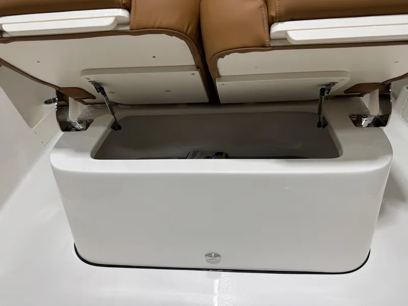 Slide: The Image of 2025 Key West 291FS boat storage compartment with cushioned seating. - 46