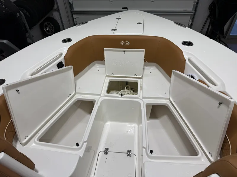 Slide: The Image of 2025 Key West 291FS boat interior with open storage compartments. - 48