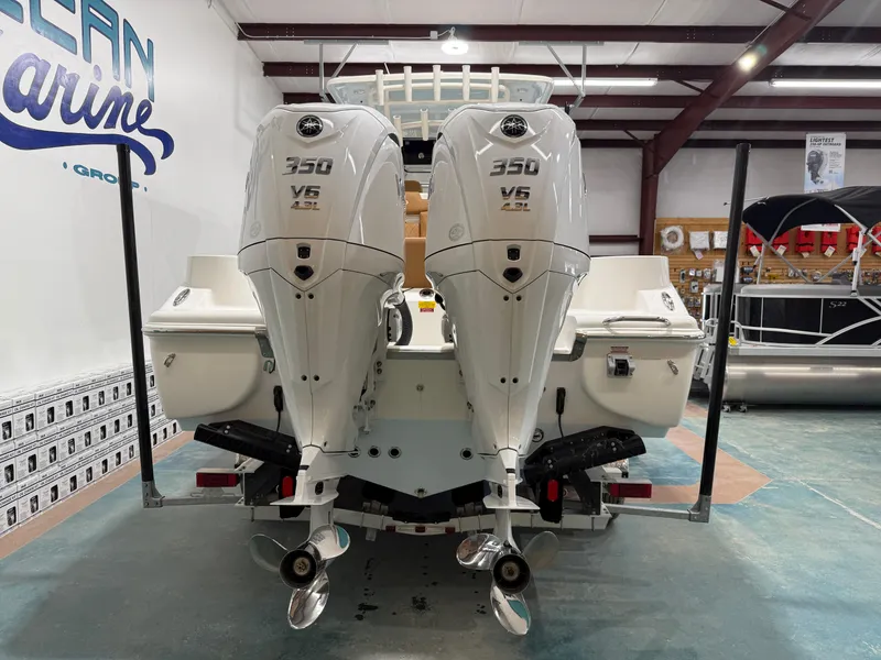 Slide: The Image of 2025 Key West 291FS boat with twin 350 V6 outboard engines in showroom. - 5