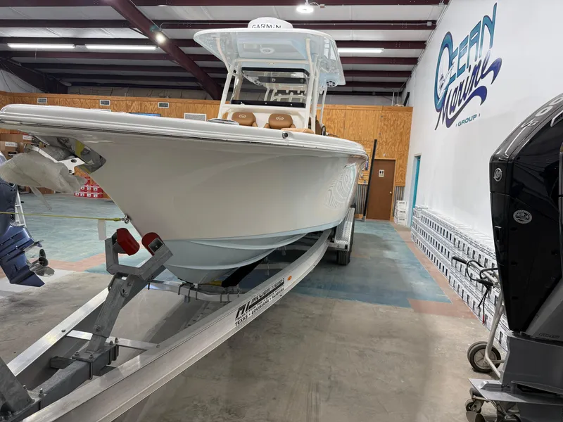 Slide: The Image of 2025 Key West 291FS boat on trailer in showroom. - 7