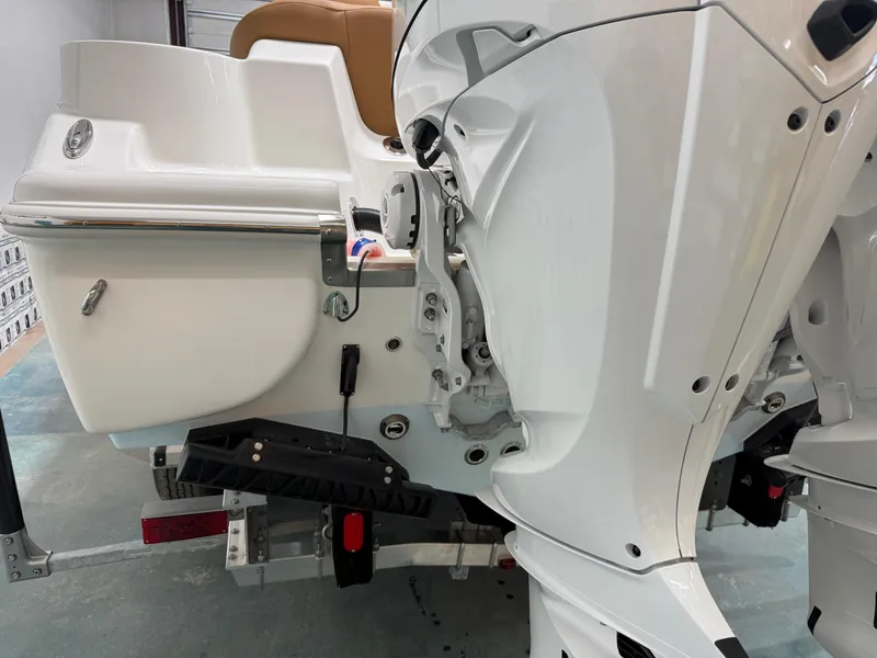 Slide: The Image of 2025 Key West 291FS boat engine and stern detail in a showroom. - 9