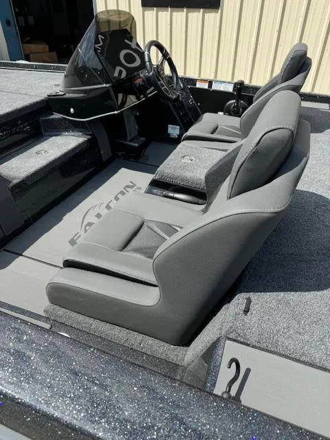 Slide: The Image of 2025 Falcon F205 boat interior with gray seats and steering console. - 3