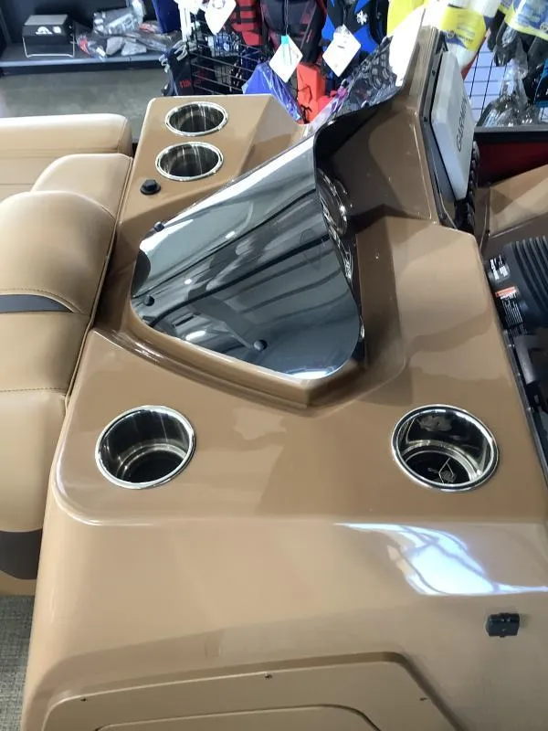 Slide: The Image of 2025 G3 Fusion 322RC boat console with cup holders and seating. - 17