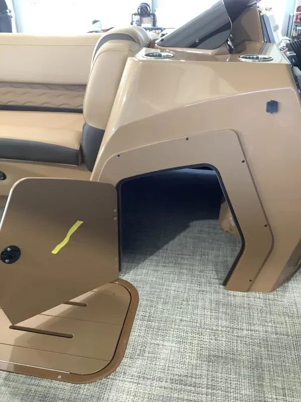 Slide: The Image of 2025 G3 Fusion 322RC boat interior with tan seating and console. - 18