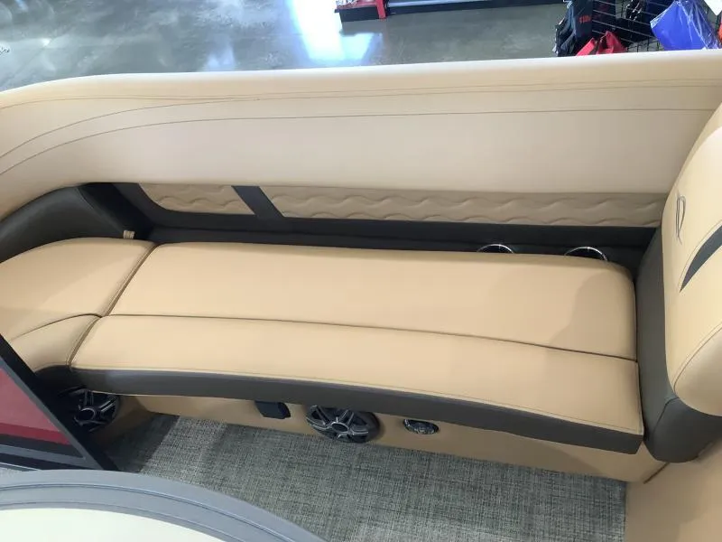Slide: The Image of 2025 G3 Fusion 322RC boat interior with beige seating and built-in speakers. - 21
