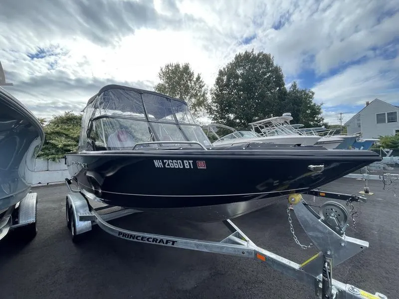 Slide: The Image of 2024 Princecraft AYB5258TS boat on trailer under cloudy sky. - 1