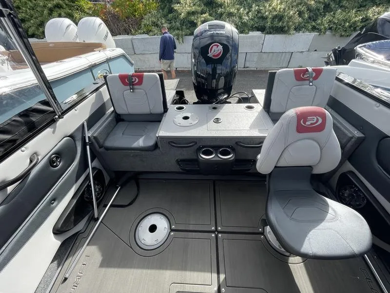 Slide: The Image of 2024 Princecraft AYB5258TS boat interior with seating and motor. - 11