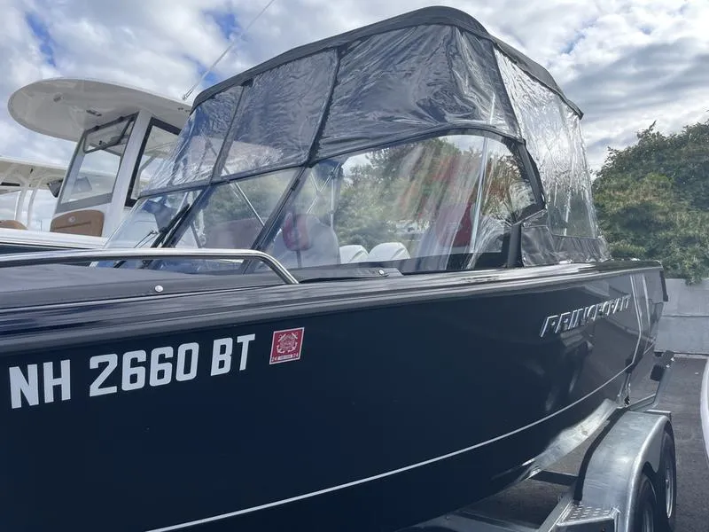Slide: The Image of 2024 Princecraft AYB5258TS boat with canopy, parked on trailer. - 4