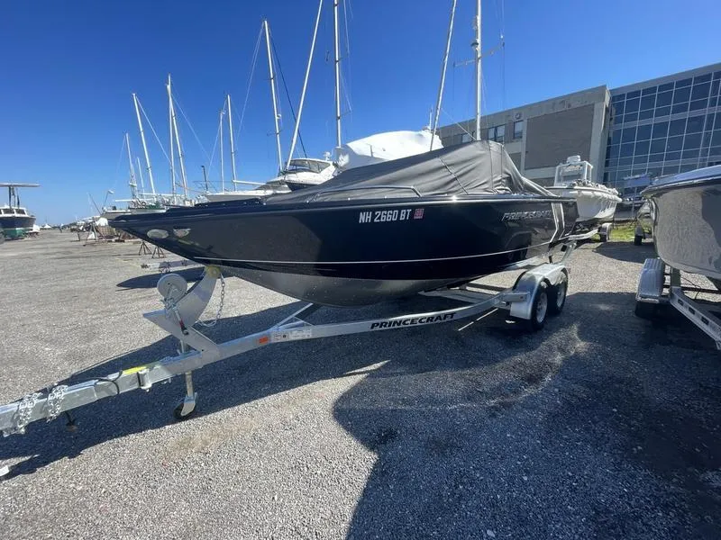 Slide: The Image of 2024 Princecraft AYB5258TS boat on trailer in marina lot. - 7