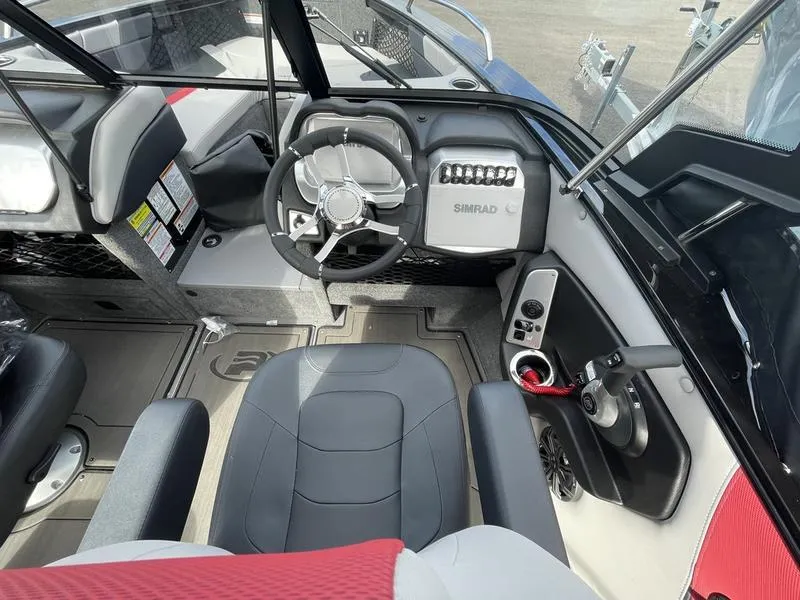 Slide: The Image of 2024 Princecraft AYB5258TS boat interior with steering wheel and dashboard controls. - 8